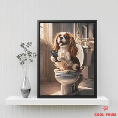 King Charles Spaniel on the Toilet with a Smartphone