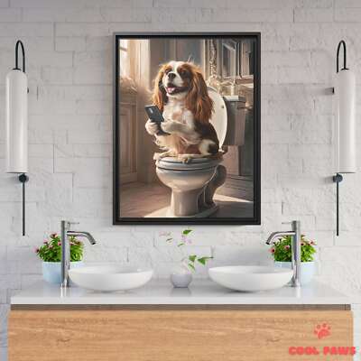 King Charles Spaniel on the Toilet with a Smartphone